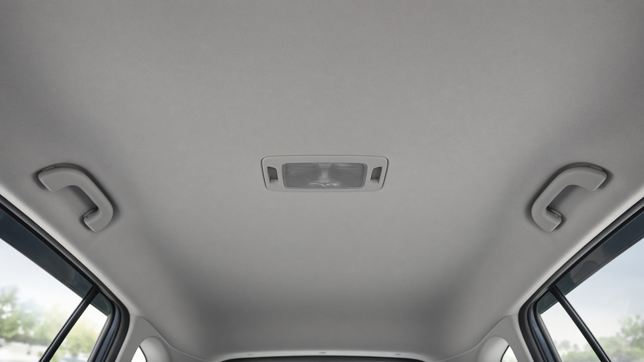 Style inspiration: a smooth light grey headliner in a vehicle cabin, seen from the back seat looking up